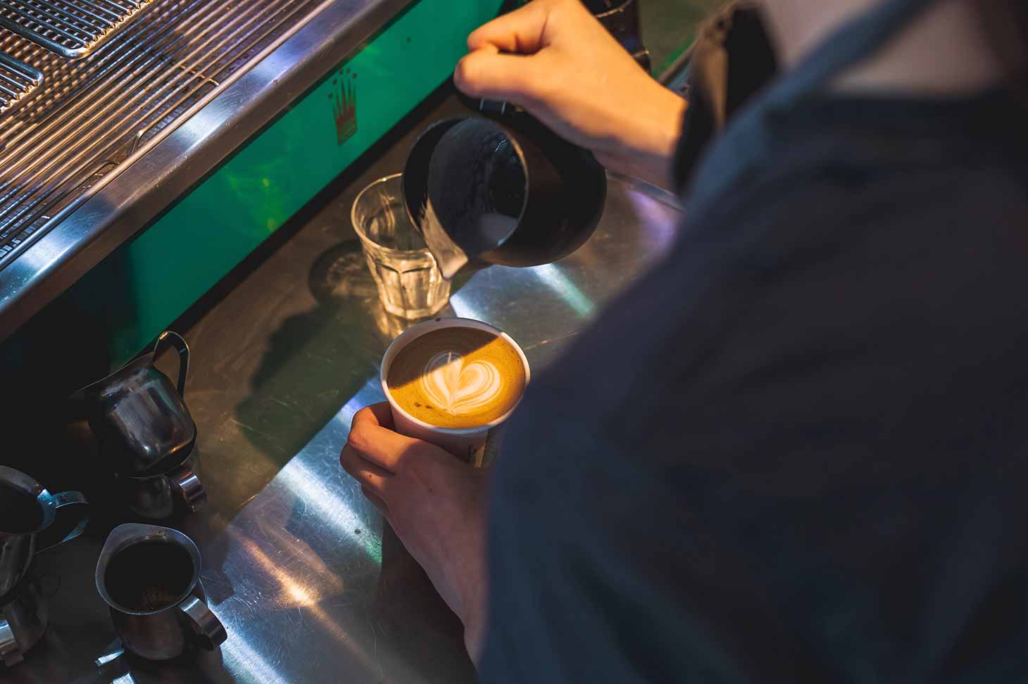 Barista tamping espresso
